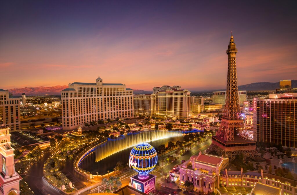 The iconic Las Vegas Strip lit up at night, featuring famous hotels and casinos